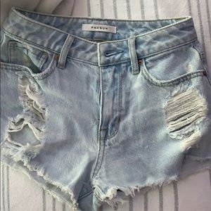 ripped light blue shorts